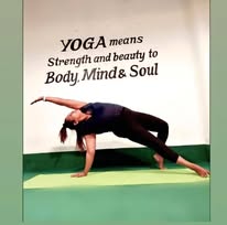 Member holding a yoga pose at Lady Fitness
